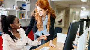 Women working on computer at Respect Outside's sexual harassment training course