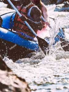 kayaking in whitewater with safety gear